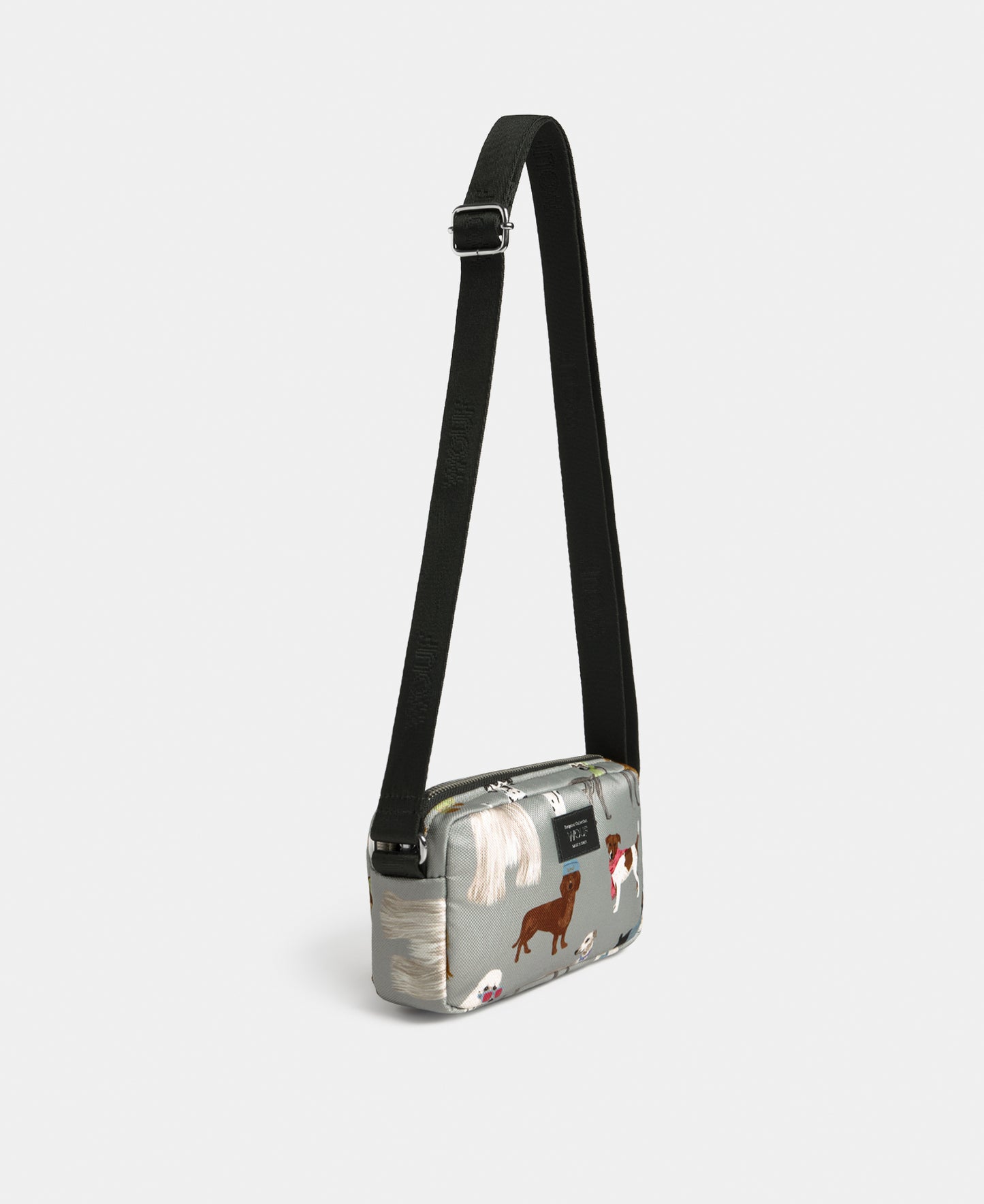 Side view of the Puppy mini crossbody bag with multicolour dog print on a grey background - Wouf