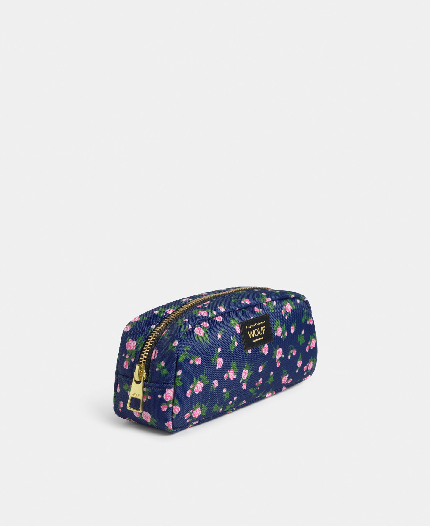 Side view of the Edith pencil case with pink and green floral print on a navy background - Wouf