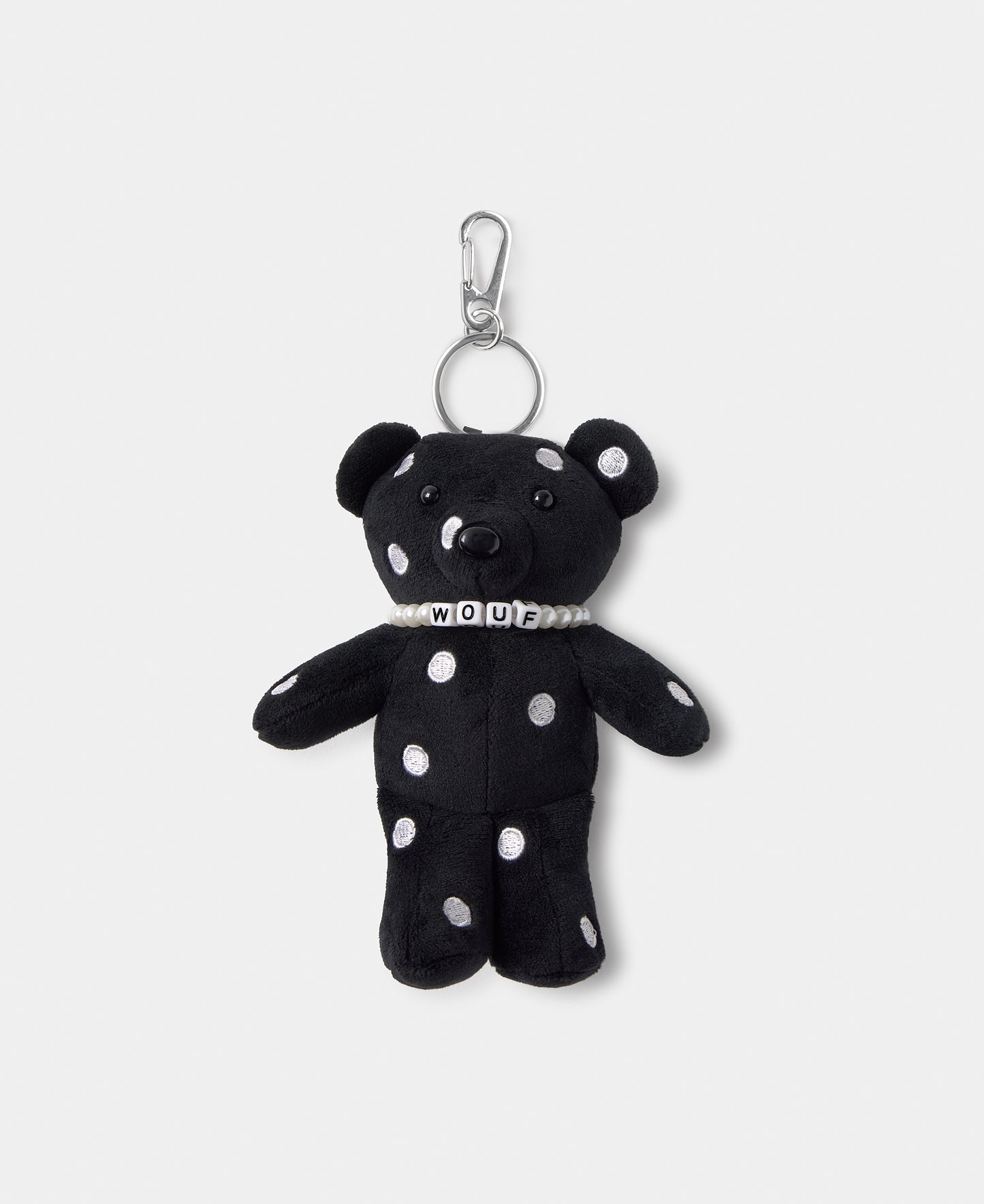 Bear-shaped bag charm with embroidered white polka dots on a black background - Wouf