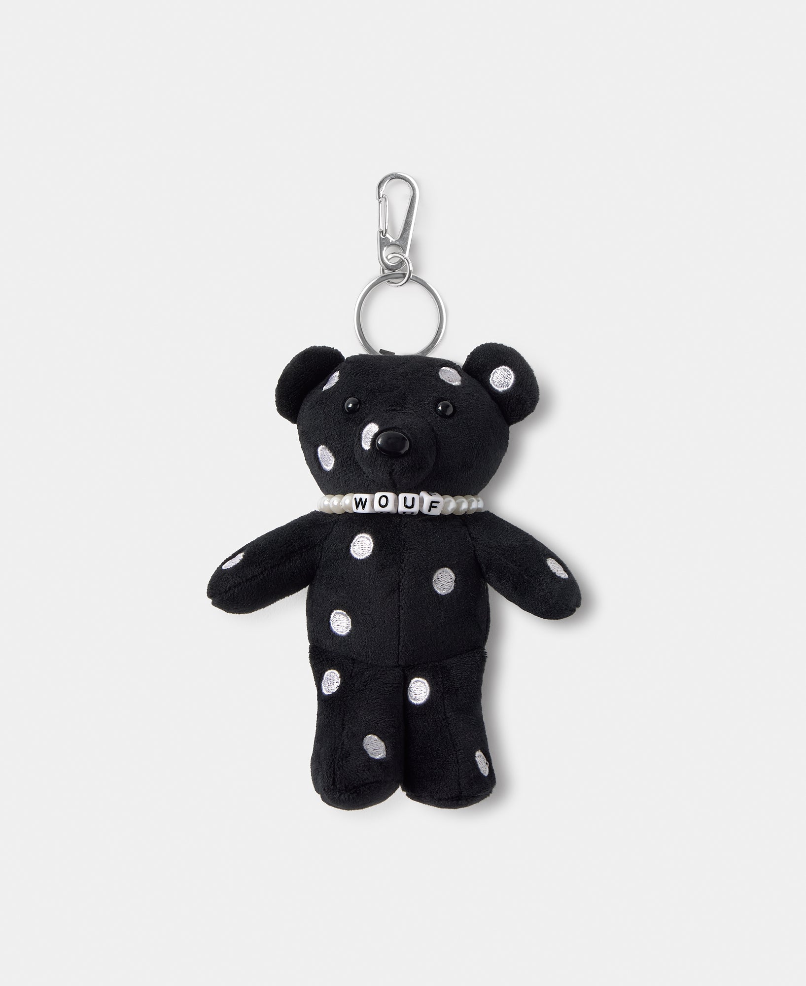 Bear-shaped bag charm with embroidered white polka dots on a black background - Wouf