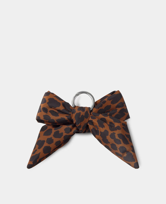 Bow-shaped bag charm with leopard print in brown and black tones - Wouf