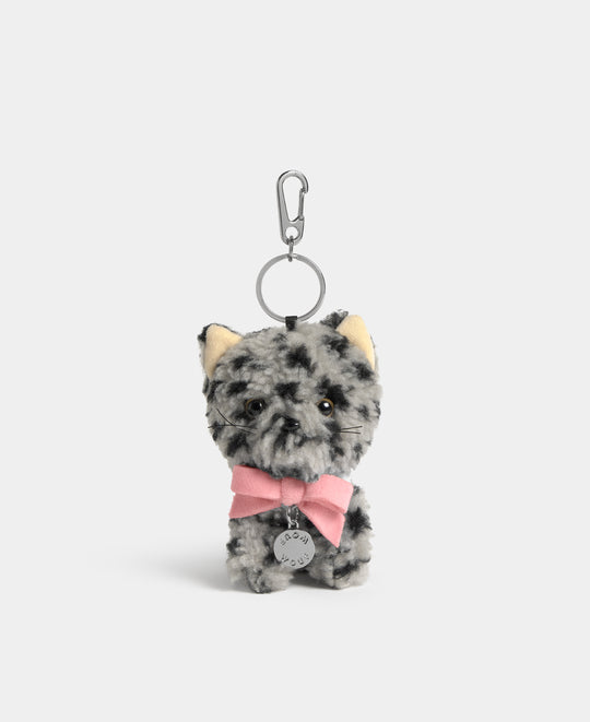 Cat-shaped bag charm in grey teddy fabric with black animal print and a pink bow - Wouf