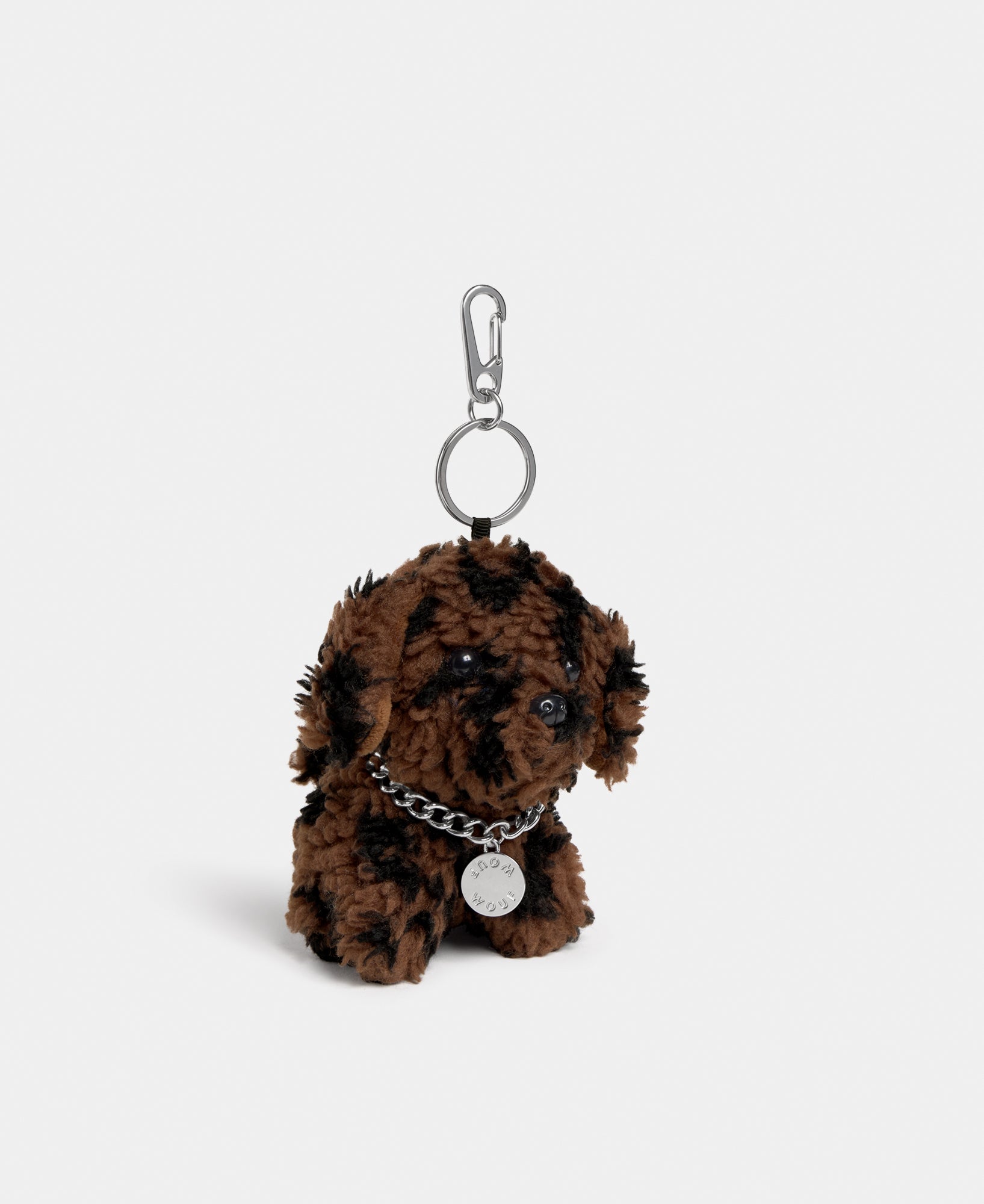 Side view of the dog-shaped bag charm in teddy fabric with leopard print in brown and black tones - Wouf