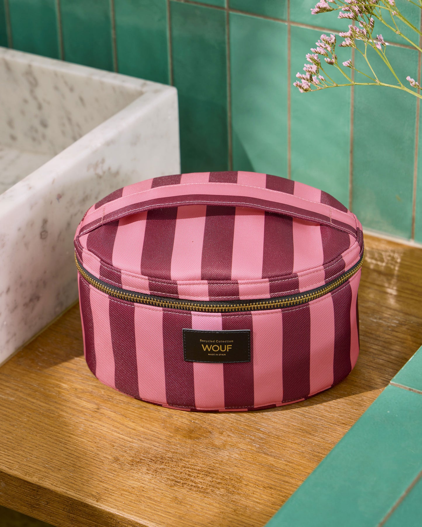 Lifestyle image of the Sophie vanity bag with pink and burgundy striped print - Wouf
