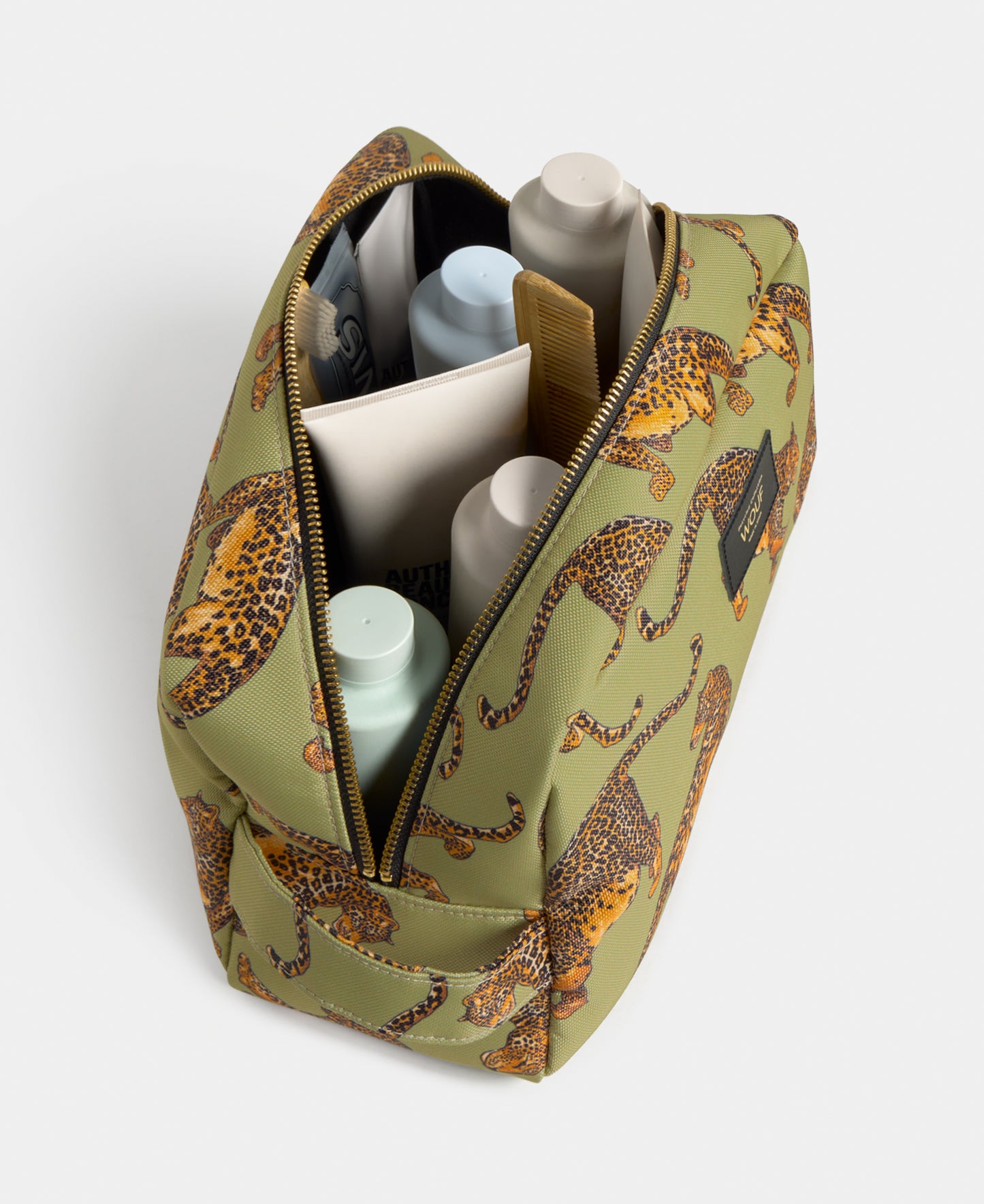 Interior detail of the Avo Leopard large toiletry bag with green and black leopard print - Wouf