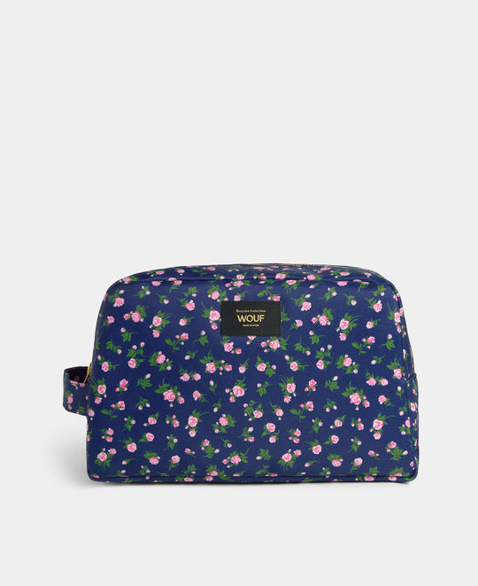 Neceser grande Edith con estampado floral en tonos rosas y verdes sobre fondo azul marino - Wouf