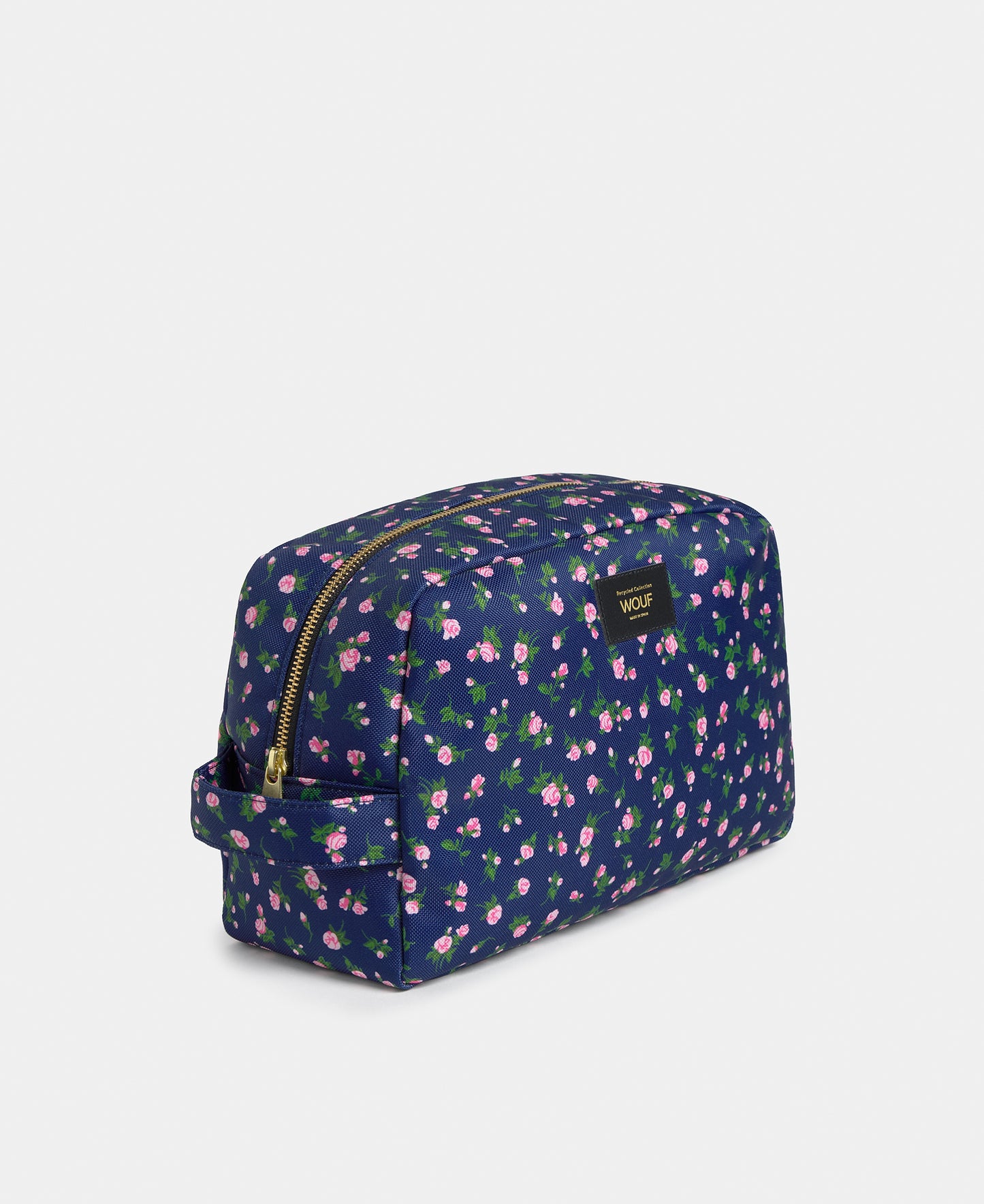 Side view of the Edith large toiletry bag with pink and green floral print on a navy background - Wouf