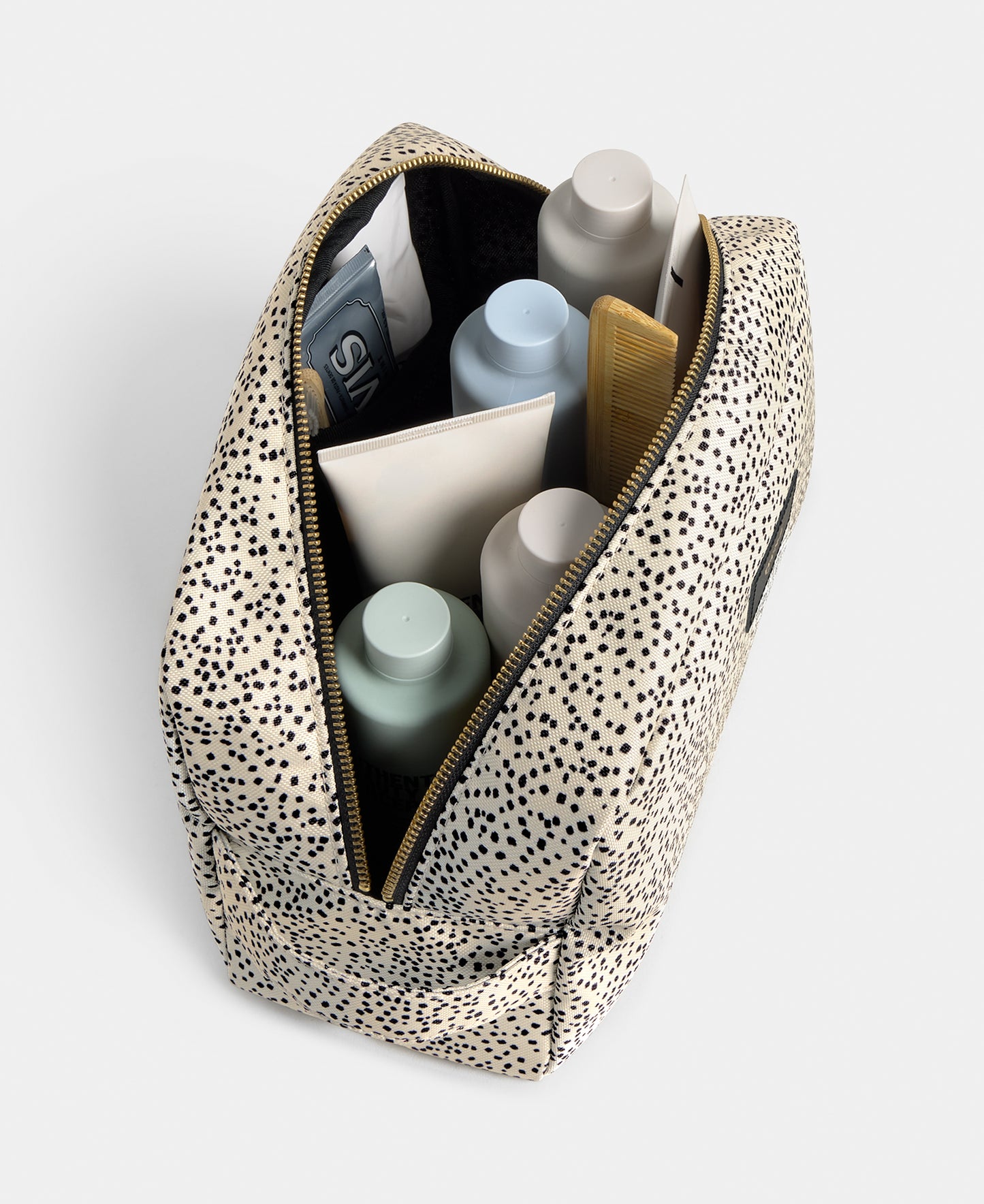 Interior detail of the Panna large toiletry bag with beige and black micro print - Wouf
