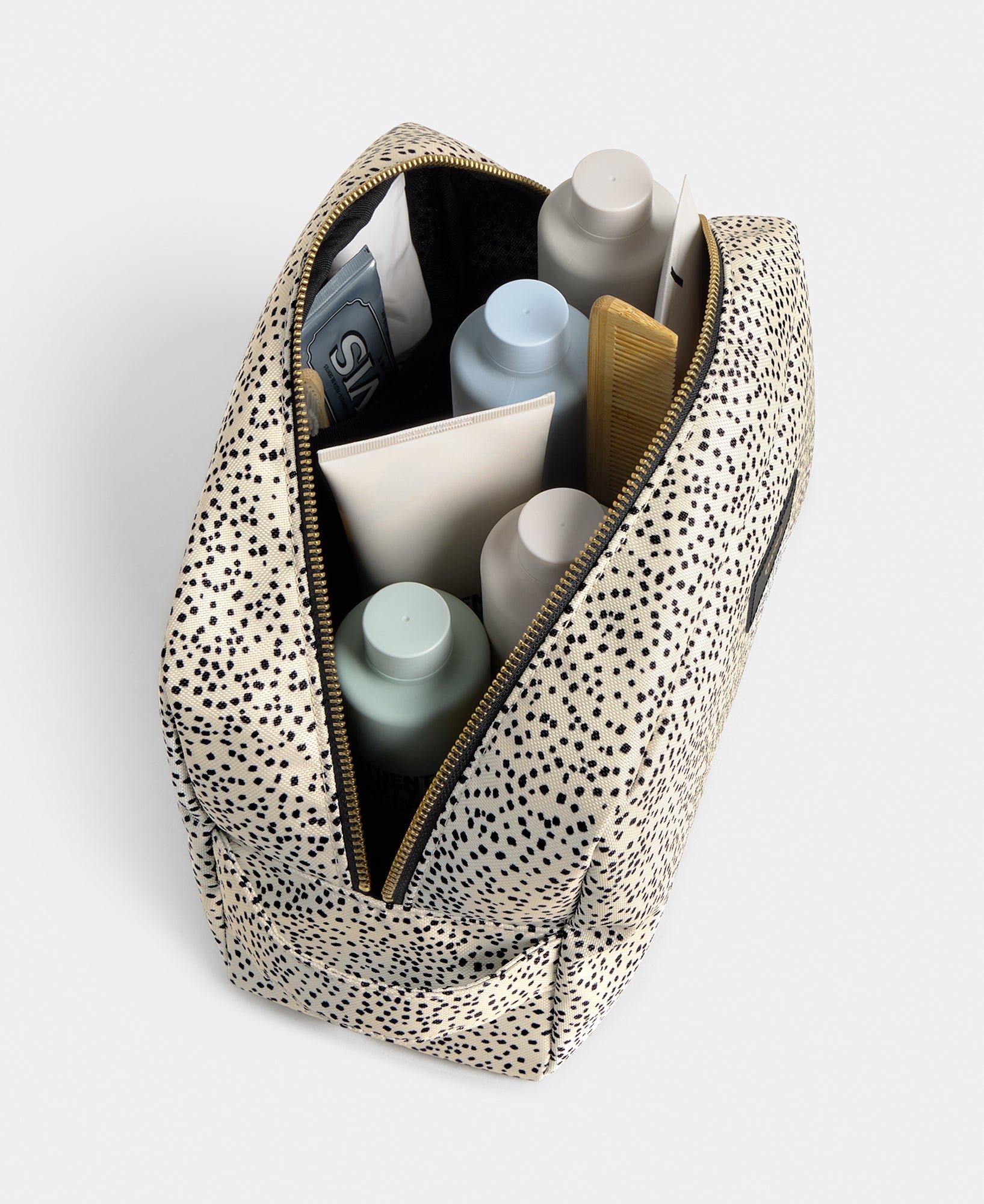 Interior detail of the Panna large toiletry bag with beige and black micro print - Wouf