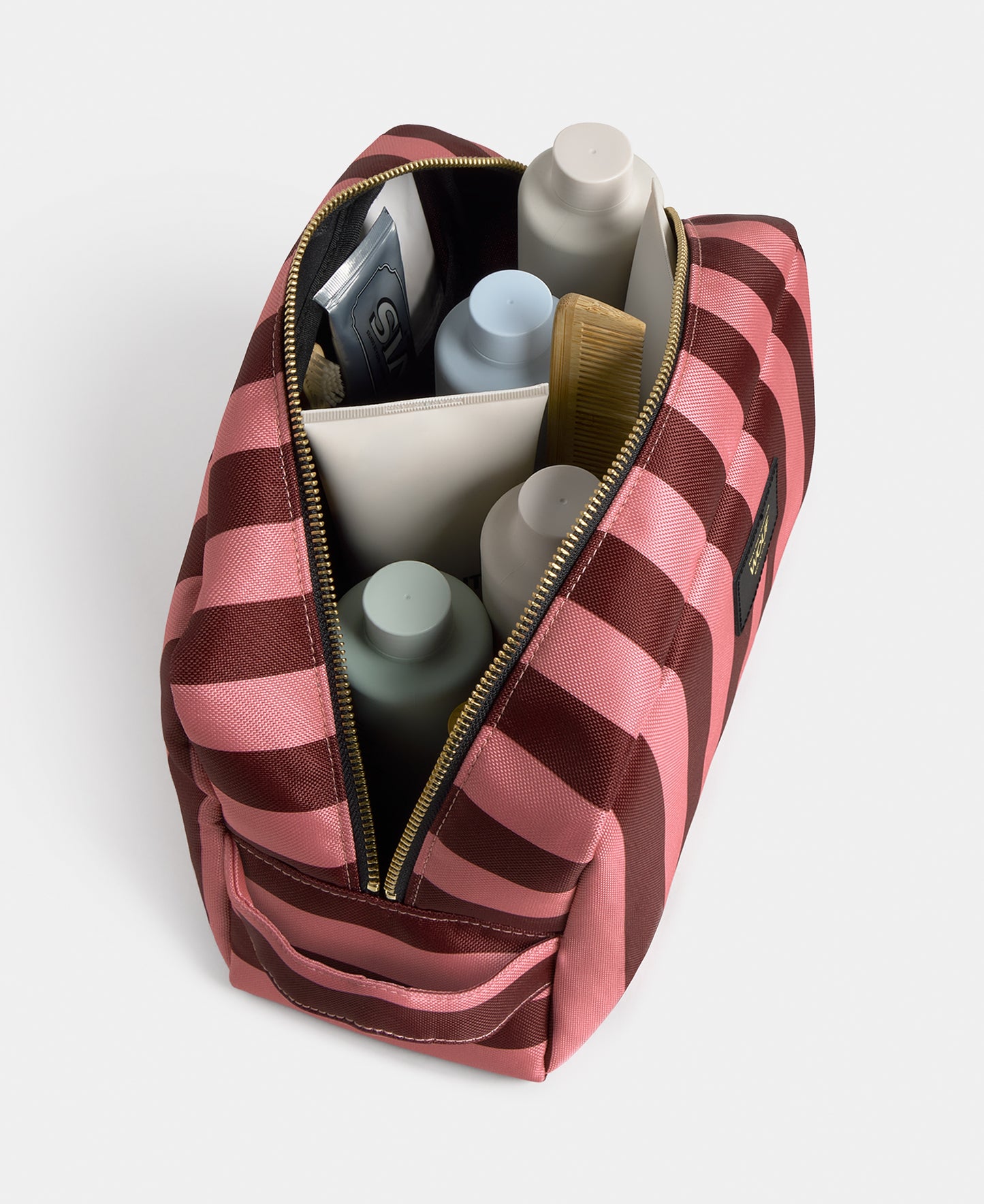 Interior detail of the Sophie large toiletry bag with pink and burgundy striped print - Wouf
