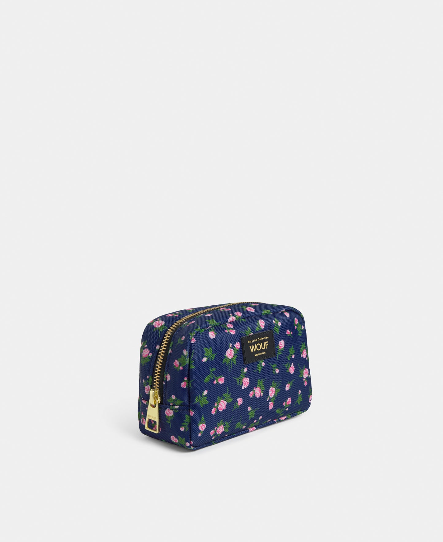 Side view of the Edith makeup bag with pink and green floral print on a navy background - Wouf