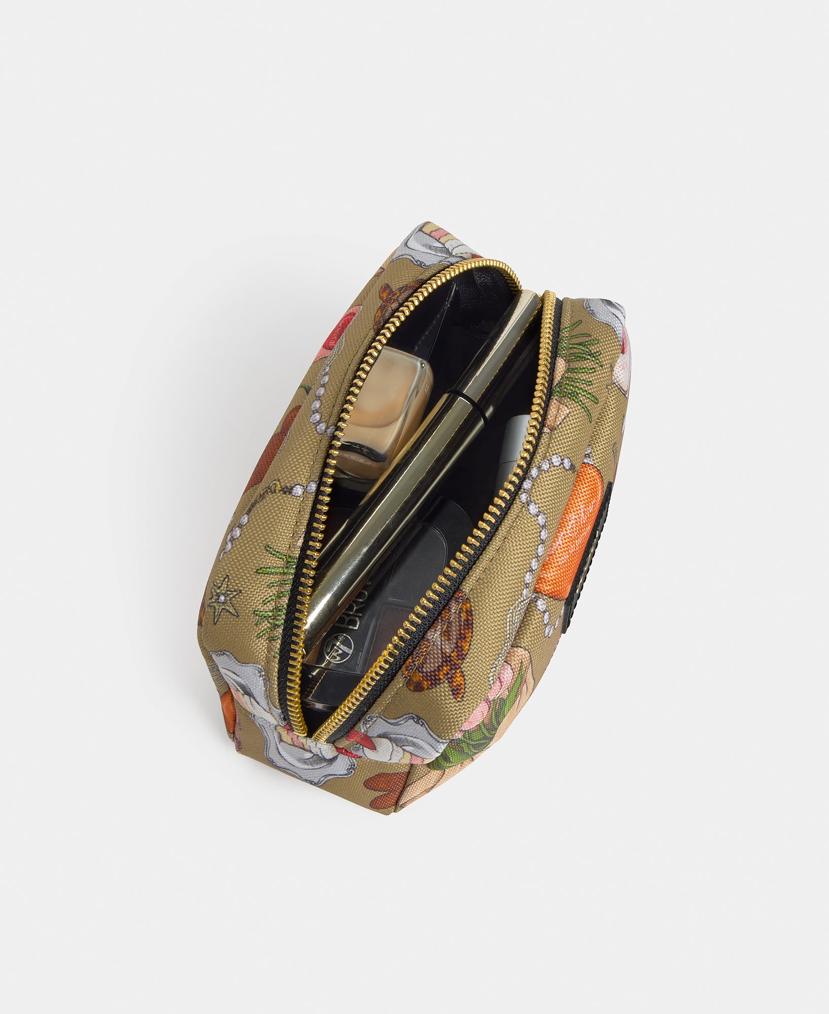 Interior detail of the Tender makeup bag with multicolour illustrated print on a khaki background - Wouf