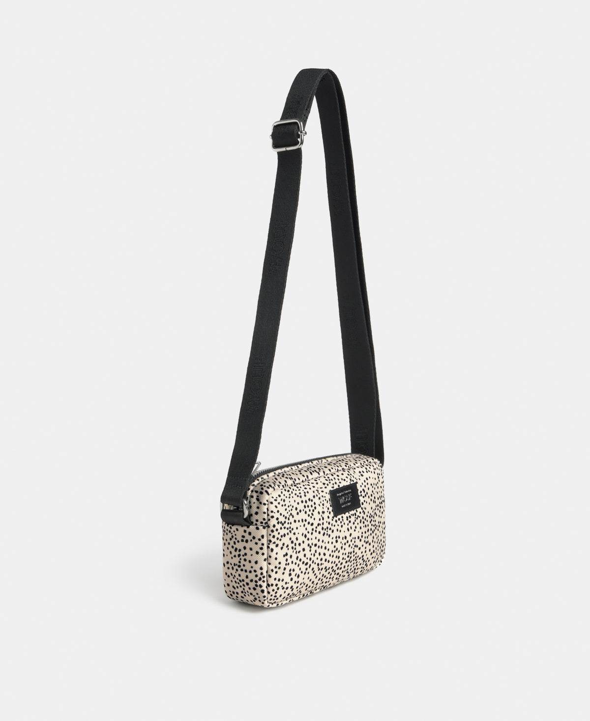 Side view of the Panna mini bag with beige and black micro print - Wouf