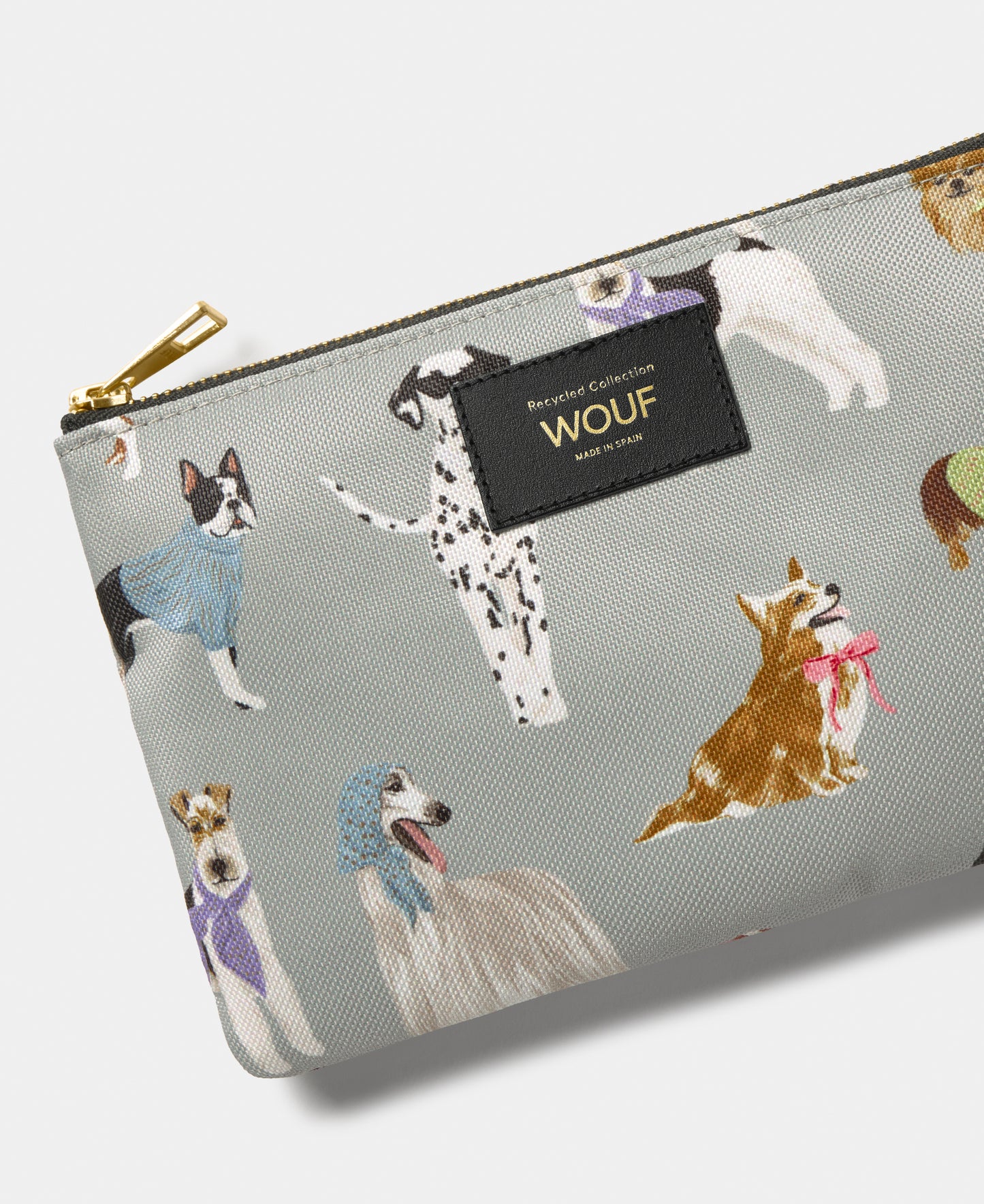 Detail of the Puppy pouch with multicolour dog print on a grey background - Wouf