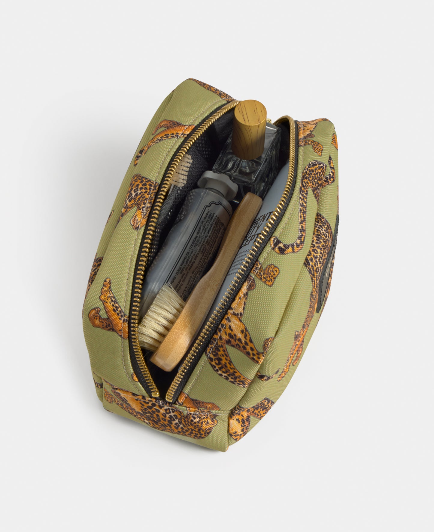 Interior detail of the Avo Leopard toiletry bag with green and black leopard print - Wouf