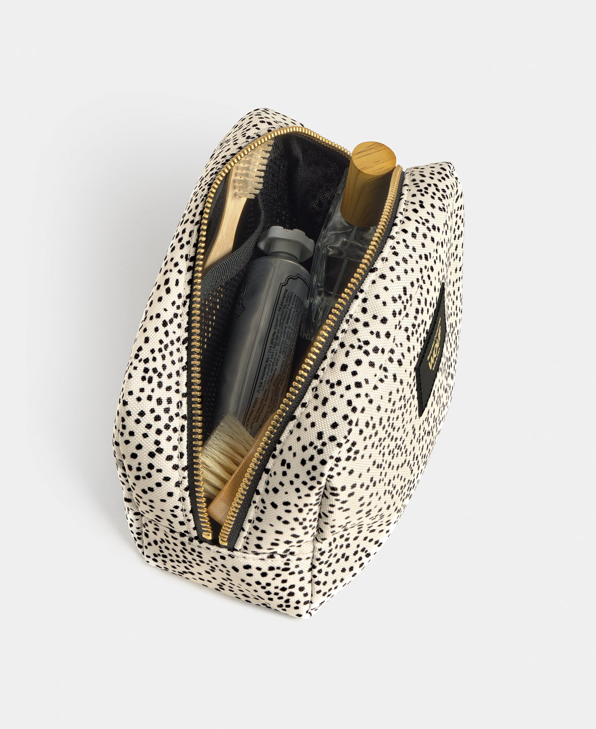 Détail intérieure de la trousse de toilette Panna à micro-imprimé beige et noir - Wouf