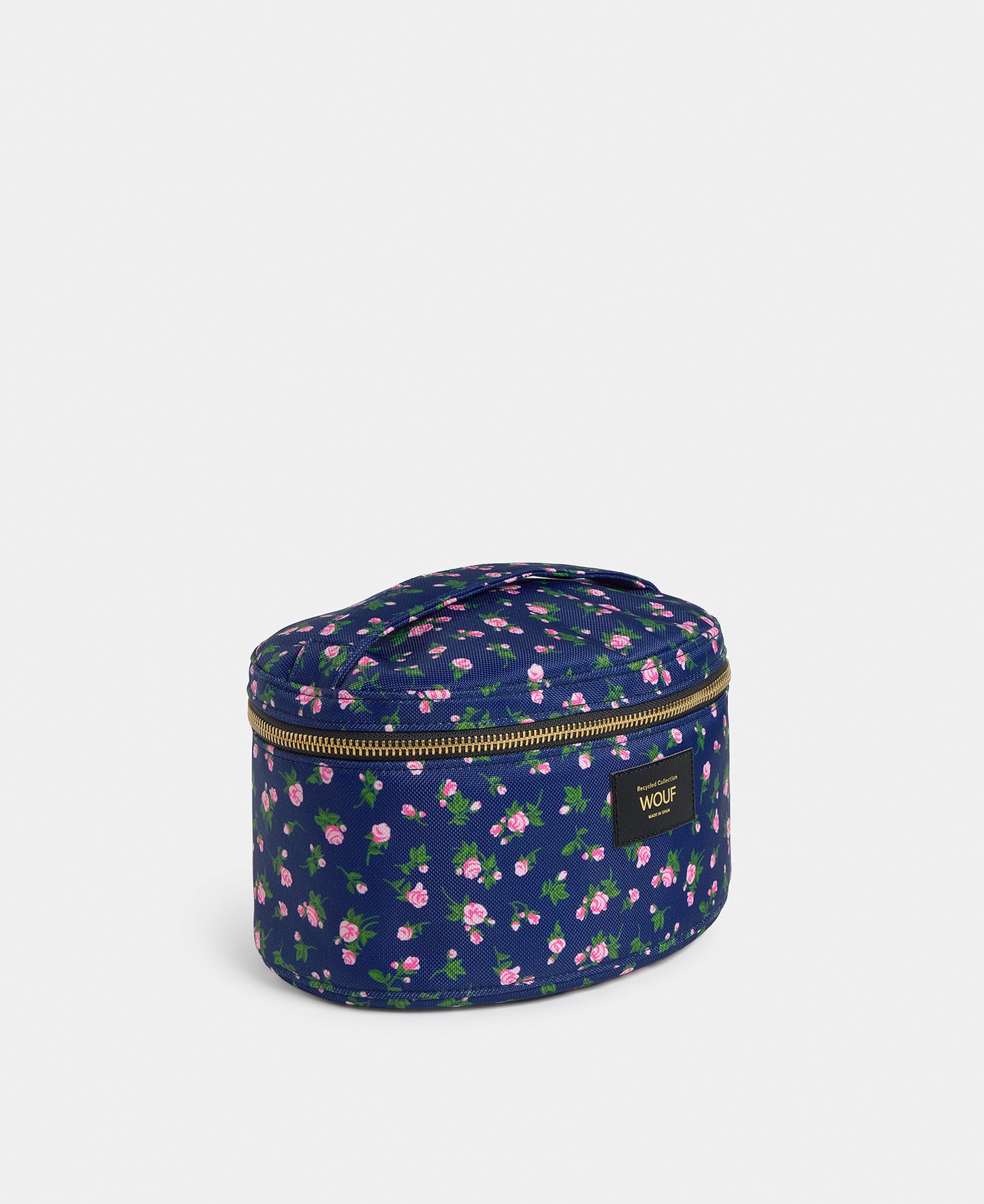 Side view of the Edith vanity bag with pink and green floral print on a navy background - Wouf