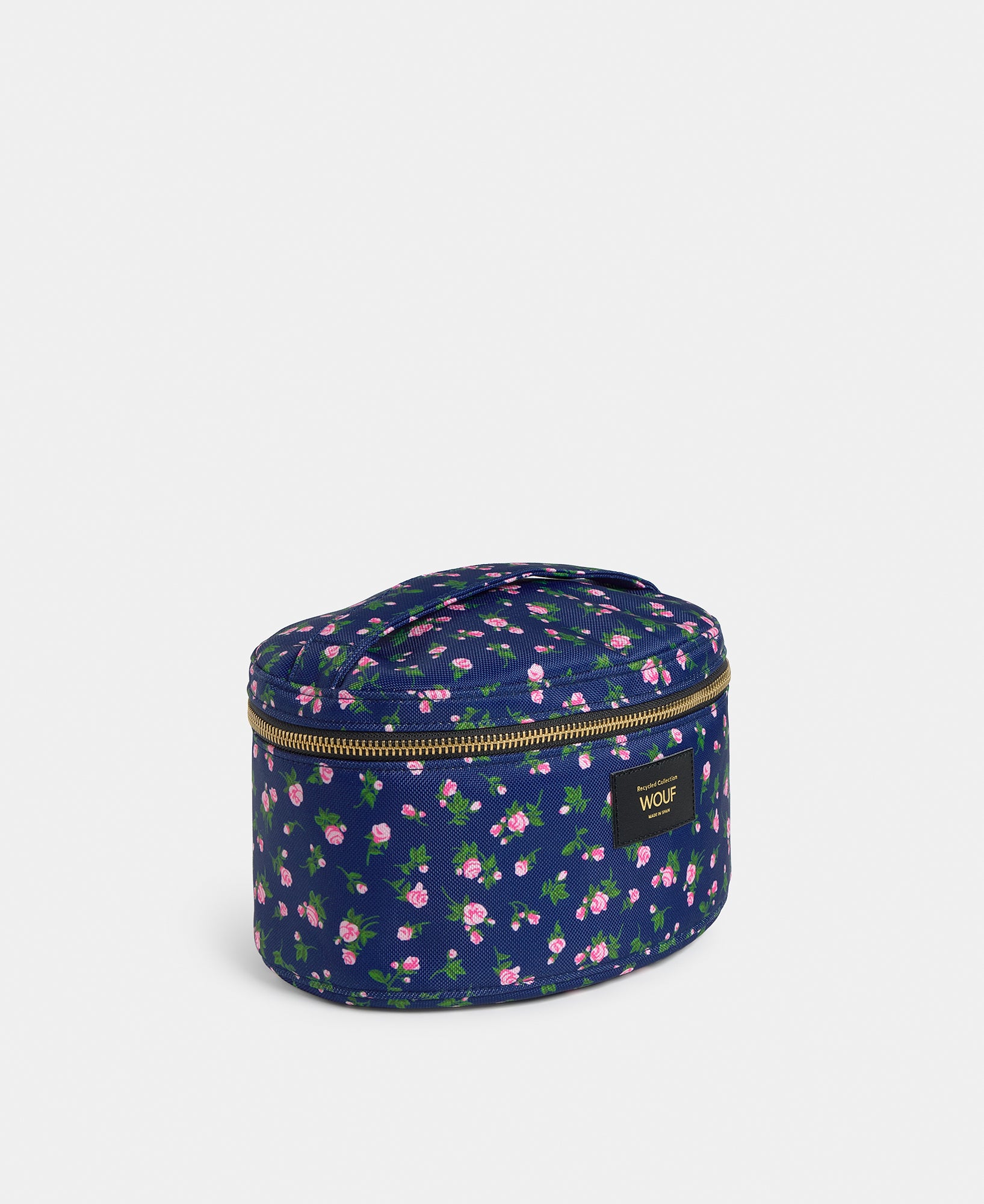 Side view of the Edith vanity bag with pink and green floral print on a navy background - Wouf