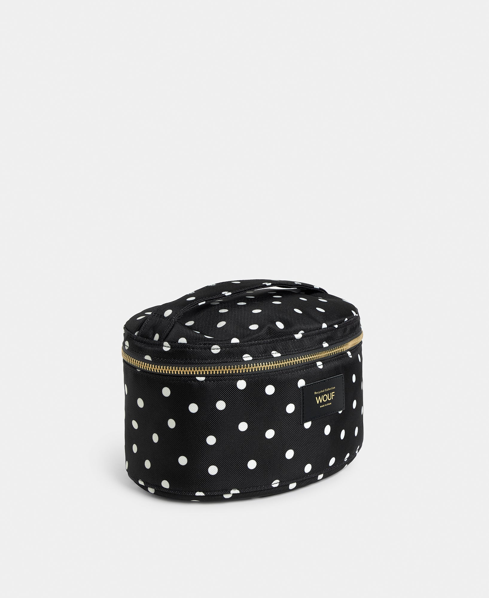 Side view of the Grace vanity bag with white polka dot print on a black background - Wouf