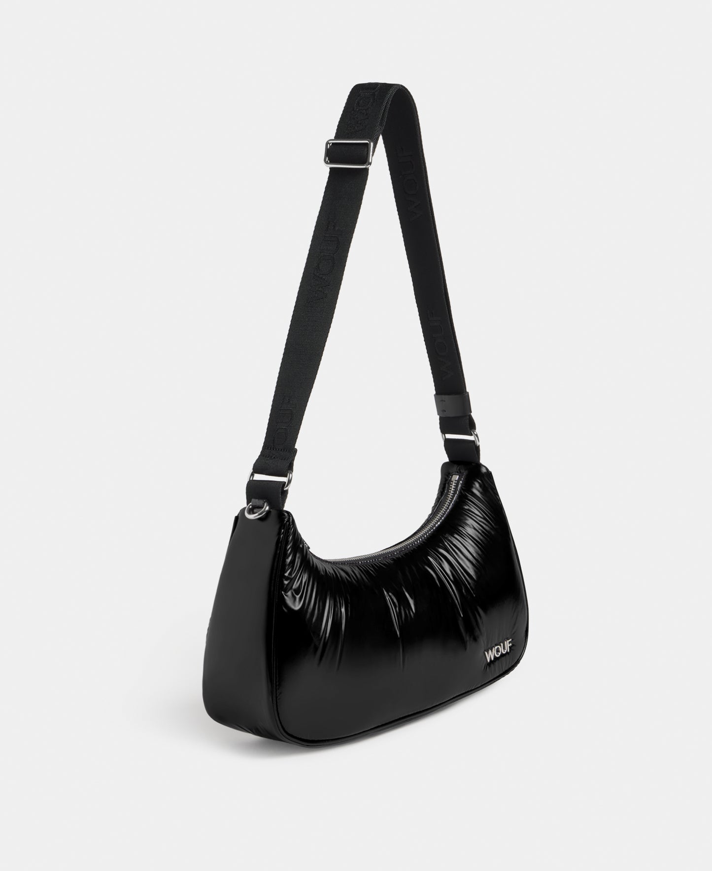 Side view of the crossbody bag black colour with a shiny finish - Wouf