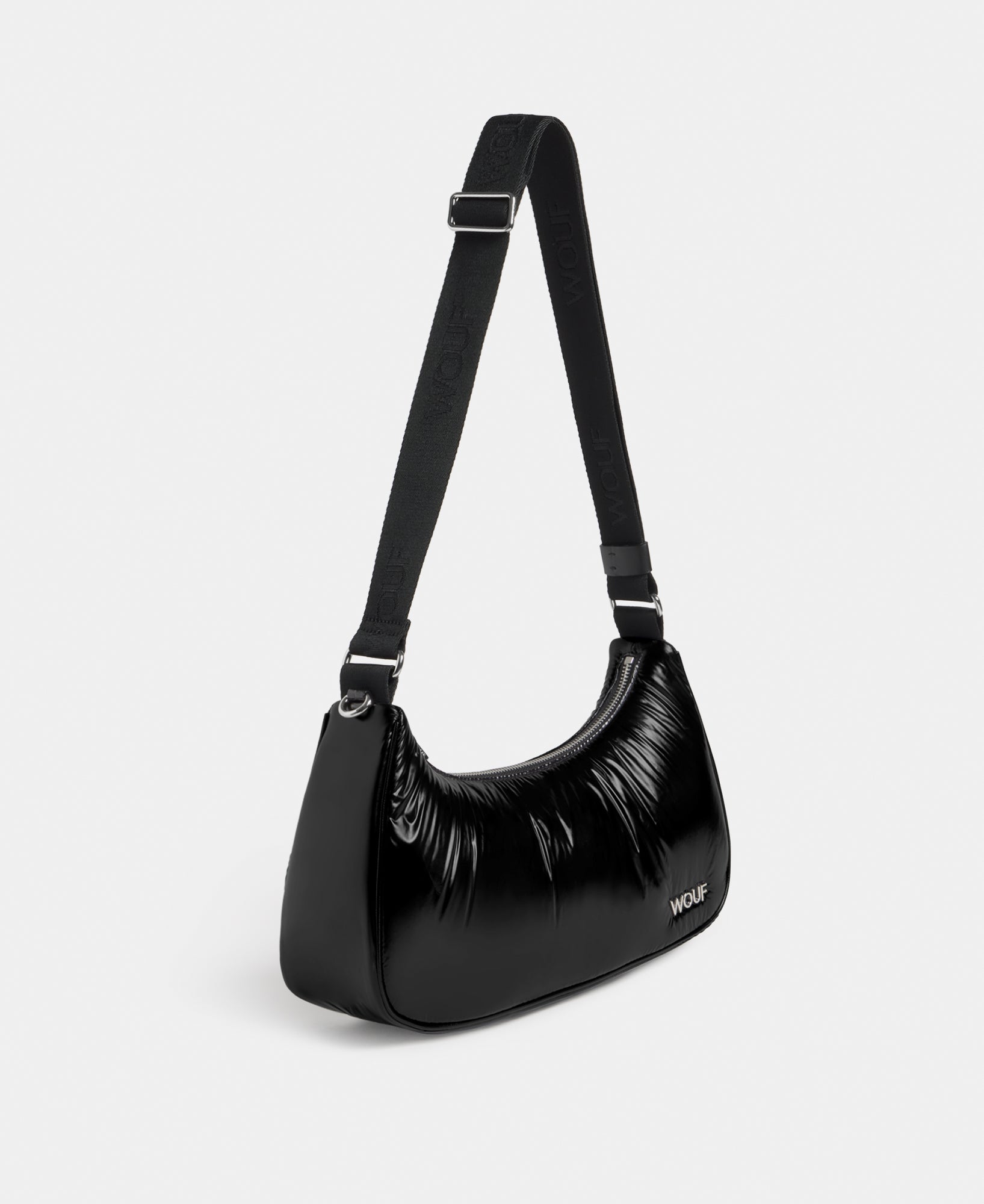 Side view of the crossbody bag black colour with a shiny finish - Wouf