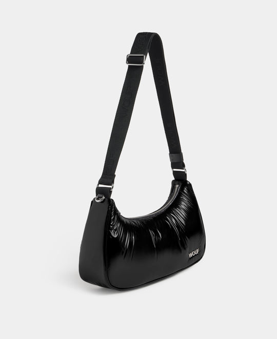Side view of the crossbody bag black colour with a shiny finish - Wouf