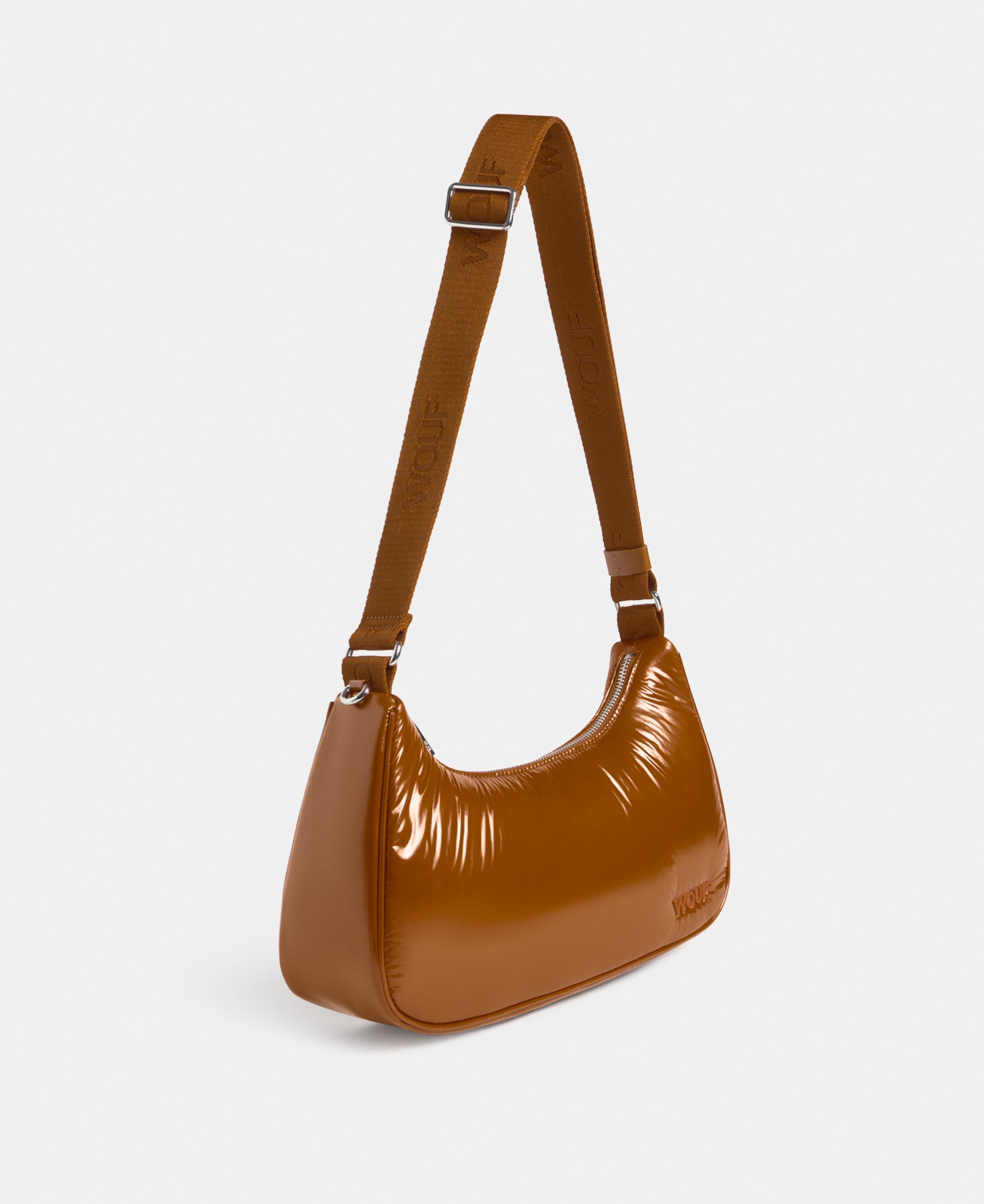 Side view of the crossbody bag toasted brown colour with a shiny finish - Wouf