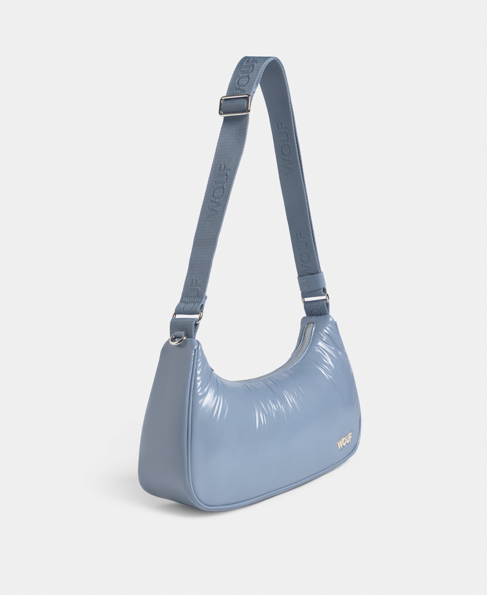Side view of the crossbody bag steel blue colour with a shiny finish - Wouf