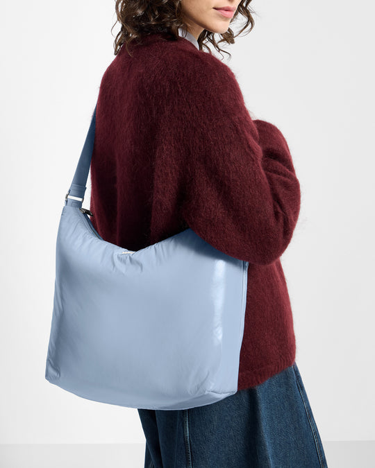 Detail of model with hobo Bag steel blue colour with a shiny finish - Wouf