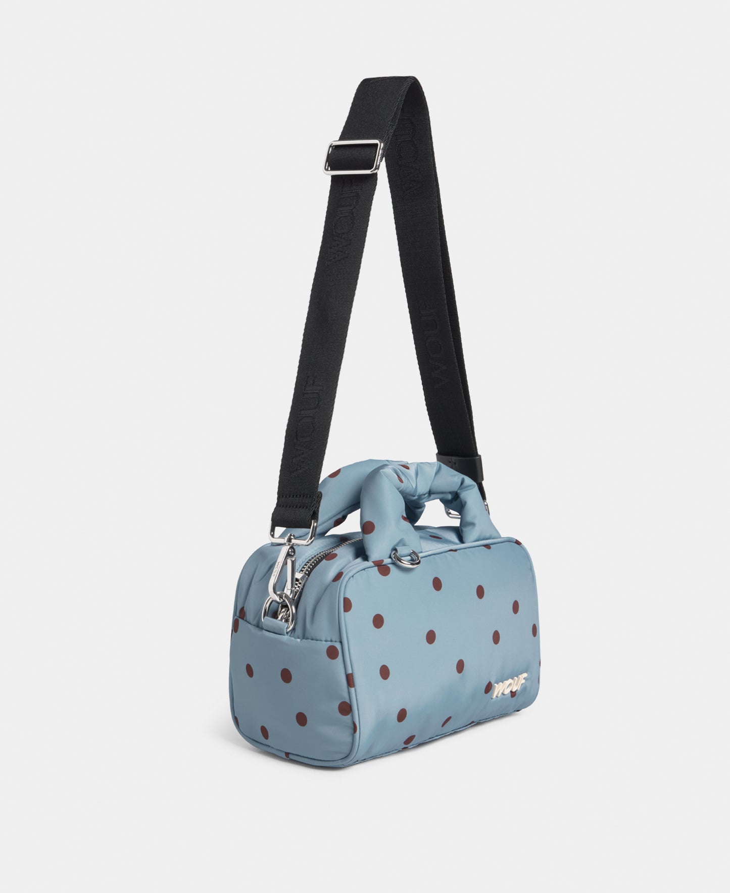 Side view of the bowling bag with brown polka dots on a light blue background - Wouf