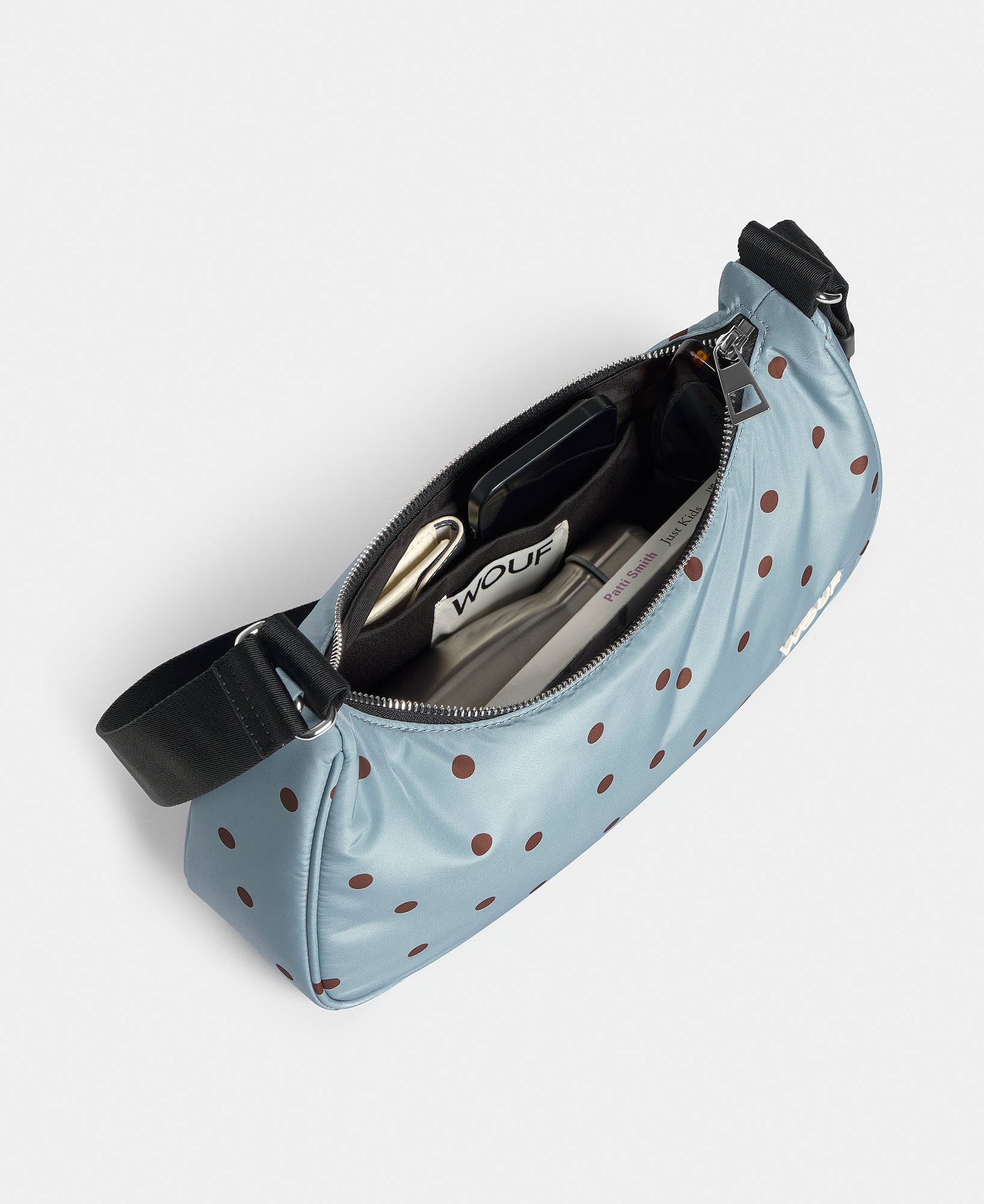 Interior of the crossbody bag with brown polka dots on a light blue background - Wouf