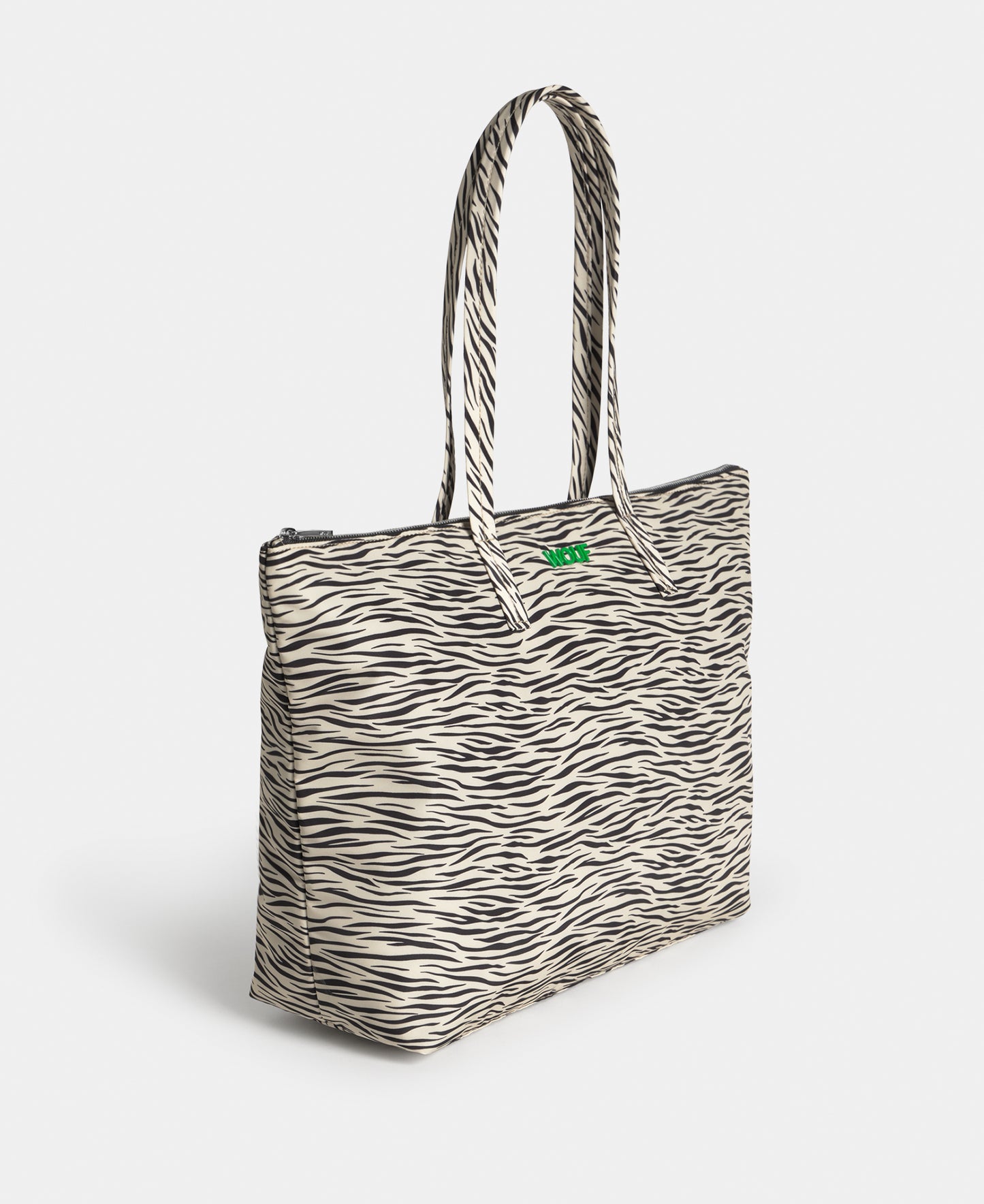 Side view of the shopper bag with zebra print in beige and black tones - Wouf