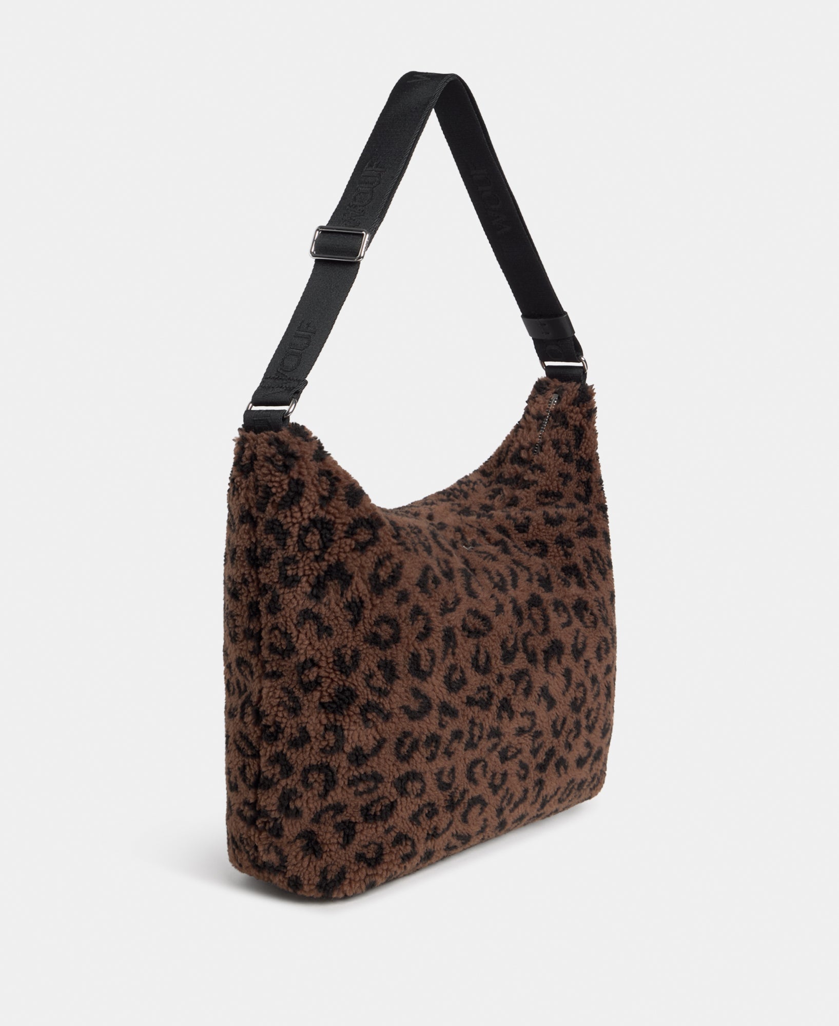 Side view of the hobo bag in teddy fabric with leopard print in brown and black tones - Wouf