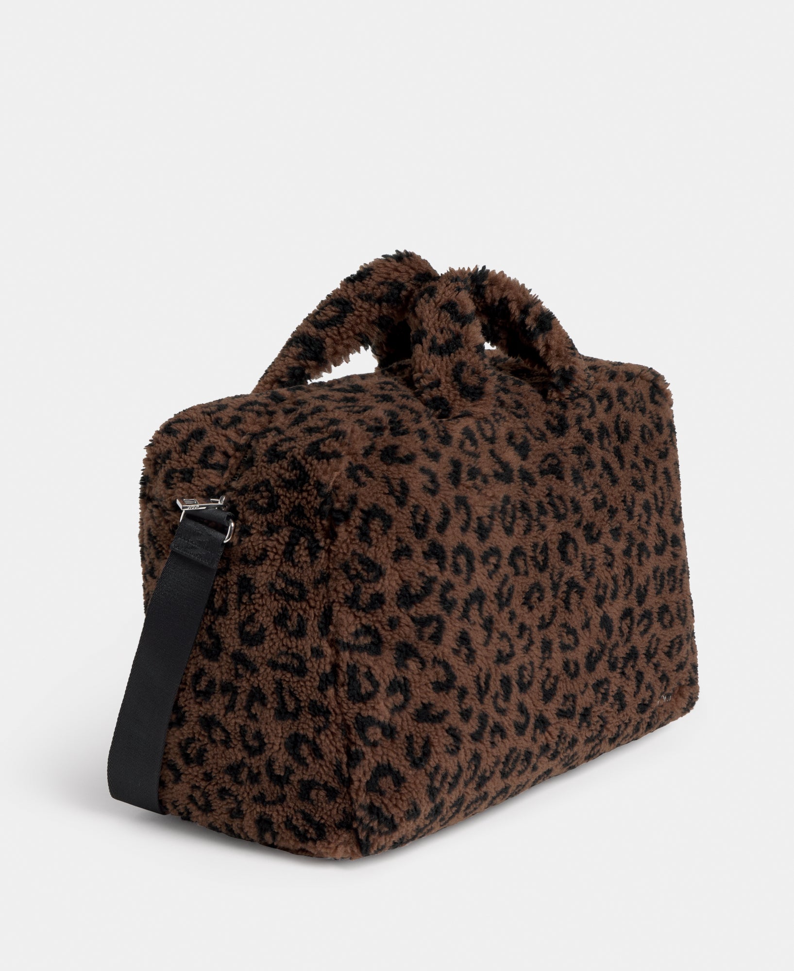 Side view of the weekend bag in teddy fabric with leopard print in brown and black tones - Wouf